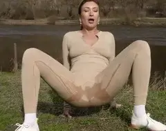 Pissing in her pants near the river