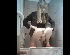 Girl pissing in college toilet